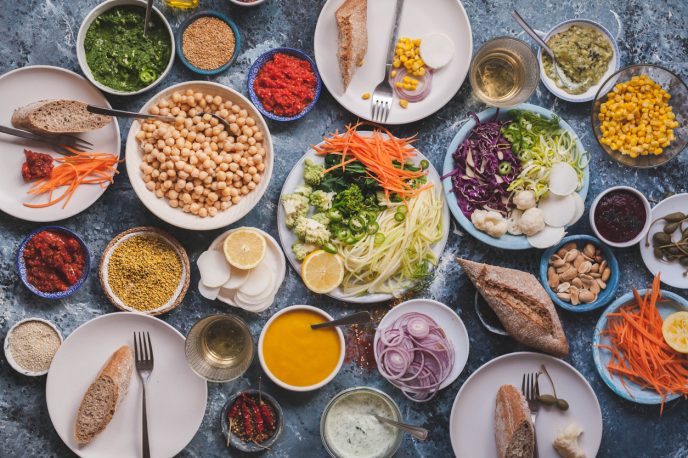 Vegan veggies meals on dinning table flat lay detox dieting food concept